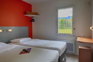 Postel nebo postele na pokoji v ubytování ibis budget Redon