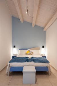 A bed or beds in a room at Casamata