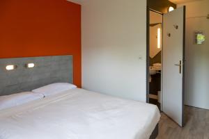 Postel nebo postele na pokoji v ubytování ibis budget Redon