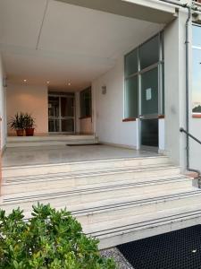 an empty porch of a building with wooden steps at Dario's House in Scandicci