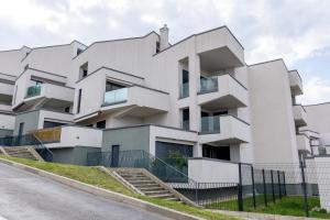 an image of a white building at Auredius Deluxe Sea Apartment in Koper