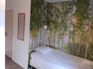 Ένα ή περισσότερα κρεβάτια σε δωμάτιο στο Hotel Velsen