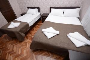 Ein Bett oder Betten in einem Zimmer der Unterkunft Olimpo Guest House