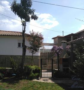 a gate in the yard of a house at Casa da Moleira in Amares