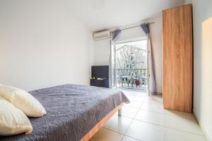 Postel nebo postele na pokoji v ubytování Apartmani Matko