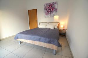 Postel nebo postele na pokoji v ubytování Apartmani Matko