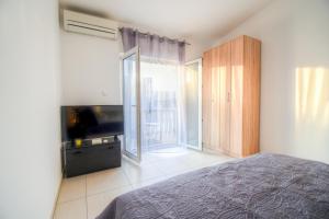 Postel nebo postele na pokoji v ubytování Apartmani Matko