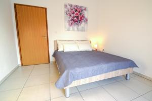 Postel nebo postele na pokoji v ubytování Apartmani Matko