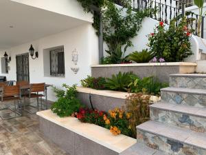 Zahrada ubytování Maison Alriad - Alojamiento familiar tranquilo cerca del mar con jardín, porche y parking privado en el interior de la finca no apto para fiestas