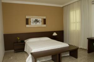 Postel nebo postele na pokoji v ubytování Santorini Hotel