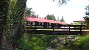 a building with a fence in front of it at k.e.m.p. inn in Krzycko Małe