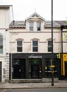 a store on the corner of a street at University Road Apartments in Belfast