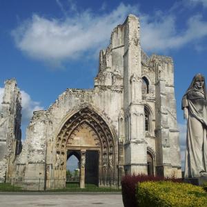 an old cathedral with a statue in front of it at Les Madeleines de Saint-Omer in Saint-Omer