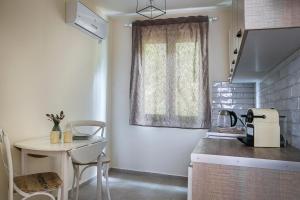 Kuchyň nebo kuchyňský kout v ubytování Martini Waterfront Suites