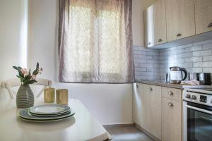 Kuchyň nebo kuchyňský kout v ubytování Martini Waterfront Suites