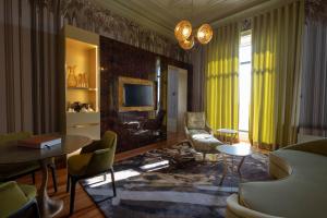 a living room with a couch and a table at Vila Foz Hotel & SPA - member of Design Hotels in Porto
