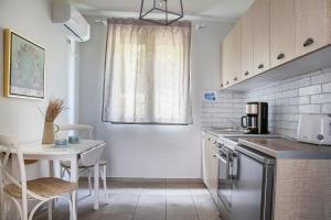 Kuchyň nebo kuchyňský kout v ubytování Martini Waterfront Suites