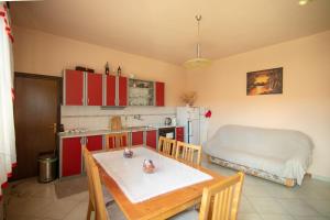 a kitchen with a table and a kitchen with a bed at Room Anton in Rakovica +9 photos