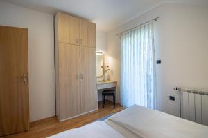 Posteľ alebo postele v izbe v ubytovaní Apartments and Room Robert
