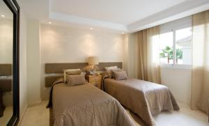 Кровать или кровати в номере Apartment 213 Guadalmansa Playa Heaven Beach Apartrments