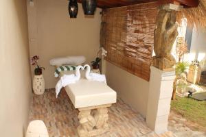 a bathroom with a sink on a brick floor at Villa Viking in Jimbaran