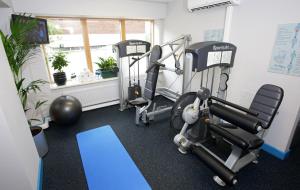 a gym with two tread machines in a room at Mespil Hotel in Dublin