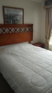 Ein Bett oder Betten in einem Zimmer der Unterkunft Departamento la Serena 1