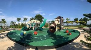 a playground in a park with a slide at Bukit Banyan Homestay Sungai Petani in Sungai Petani