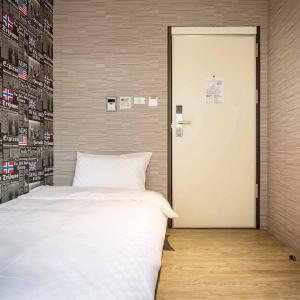 A bed or beds in a room at The Cole Hotel