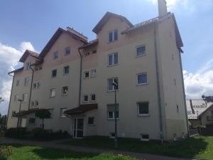 a large white building with a cross on top at Salt Mine Apartment 64m2 in Wieliczka