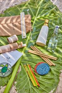 a table with a green leaf with items on it at Taj Exotica Resort & Spa, Andamans in Havelock Island