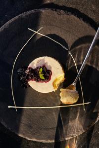 a plate with a piece of food on a fork at Taj Exotica Resort & Spa, Andamans in Havelock Island