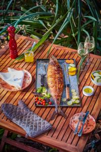 a table with a plate of food on it at Taj Exotica Resort & Spa, Andamans in Havelock Island