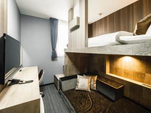 TV a/nebo společenská místnost v ubytování Hotel Areaone Kitaibaraki