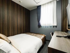 Postel nebo postele na pokoji v ubytování Hotel Areaone Kitaibaraki + 37 fotografií