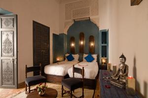 Postel nebo postele na pokoji v ubytování Riad Cinnamon by Marrakech Riad