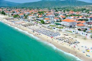 an aerial view of a beach with people and umbrellas at Candy's Boutique Rooms in Asprovalta