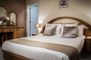 Postel nebo postele na pokoji v ubytování Manor Court Luxury Apartment