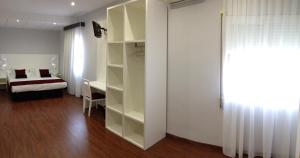 A bed or beds in a room at Hotel Pepo