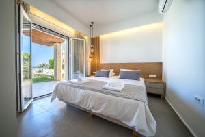 Posteľ alebo postele v izbe v ubytovaní Lofos Village Chania