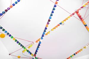 a group of colored beads on a wire at B&B DRUUM in Brussels