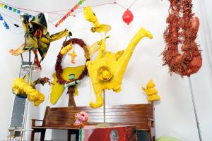a wall filled with lots of stuffed animals and a bench at B&B DRUUM in Brussels