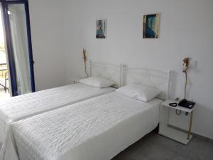 Krevet ili kreveti u jedinici u okviru objekta Hotel Poulakis
