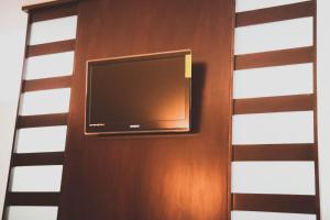 En tv och/eller ett underhållningssystem på Hotel Rincon del Cielo