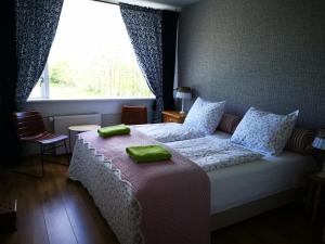 Postel nebo postele na pokoji v ubytování Bed & Breakfast Prins Hendrik (Zuidschermer)
