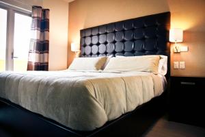Postel nebo postele na pokoji v ubytování Hotel Rincon del Cielo