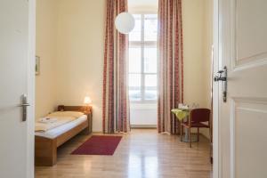 A bed or beds in a room at Gästehaus im Priesterseminar Salzburg