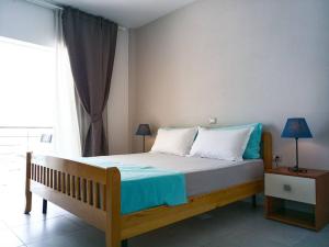 Voodi või voodid majutusasutuse Sunset Boulevard Hotel toas