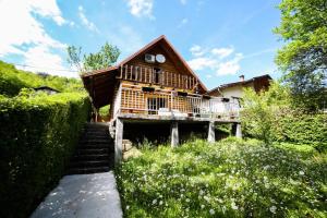 a house with a staircase leading to it at Brvnara Pliva 20m jezero rostilj Relax in Nature in Jajce