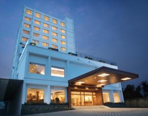 a rendering of a hotel building at night at Monsoon Empress Kochi in Cochin